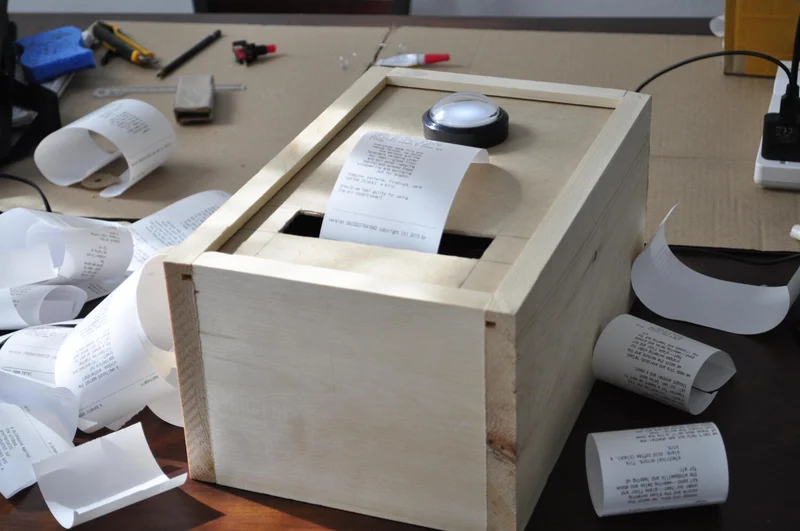 The poetron in my workshop surrounded by test print receipts