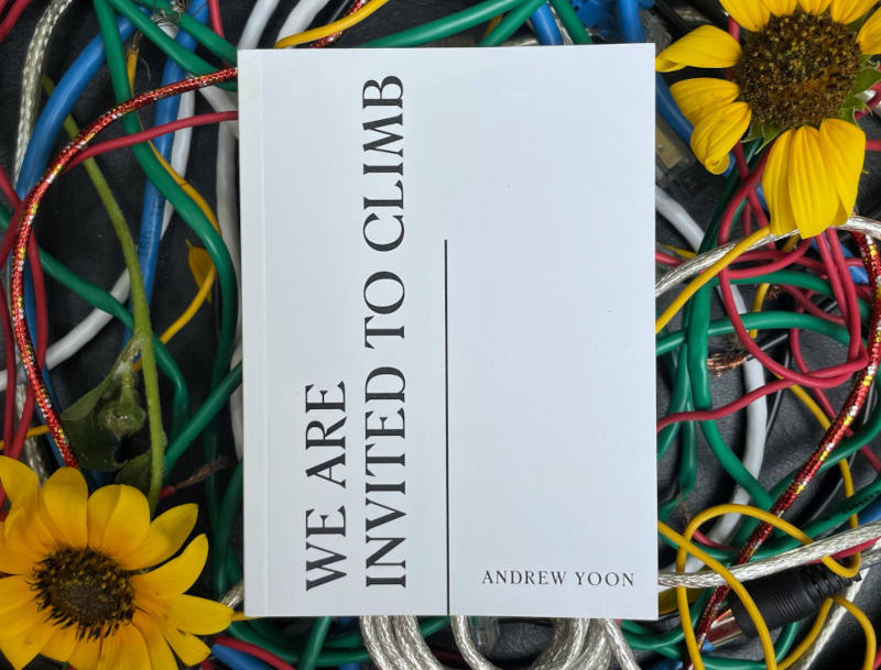 a small pocketbook of poems titled "We Are Invited to Climb"